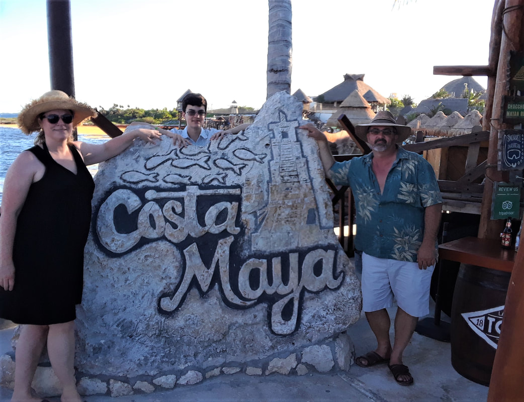Emily, her husband, and her son in Costa Maya, Mexico.
