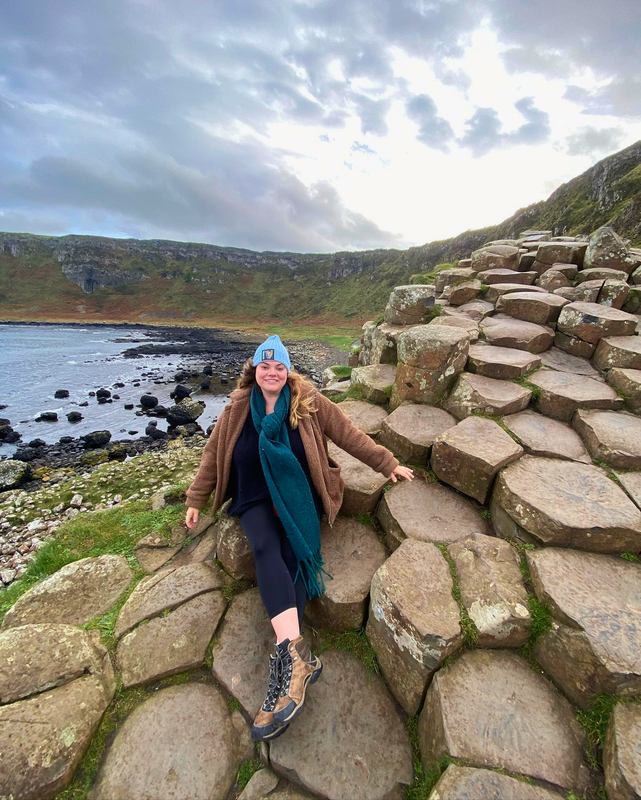 girl at giants causeway in northern ireland 