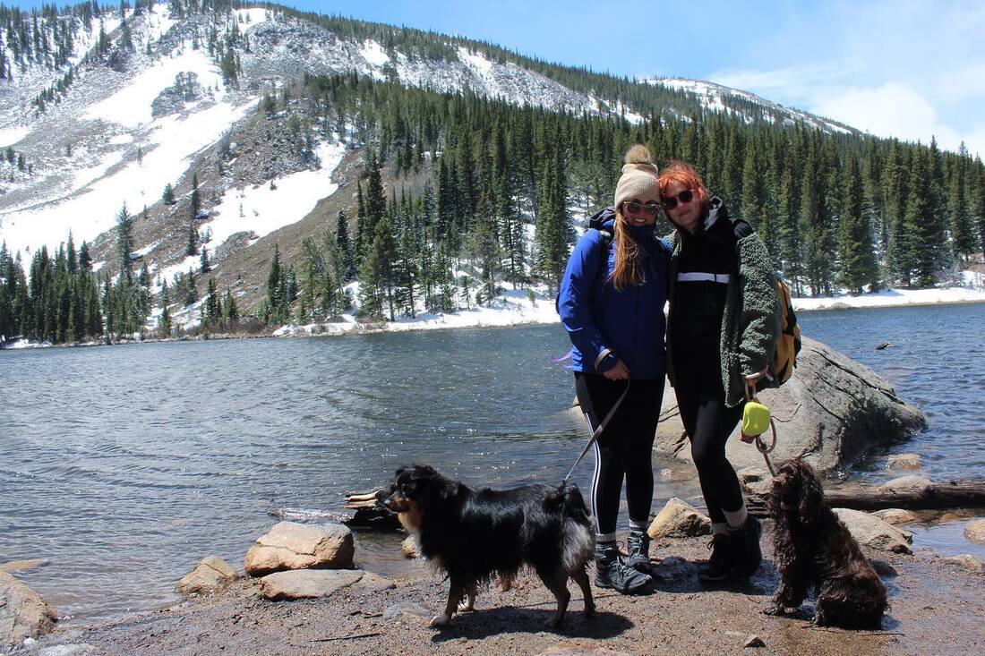 friends hiking in boulder colorado with dogs 