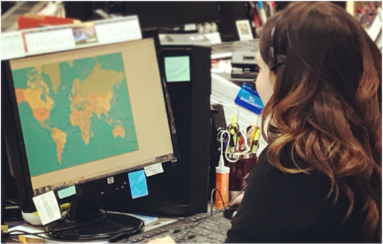 woman looking at map on computer 