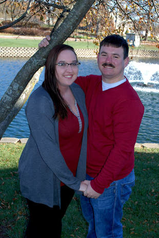 Couple posing near fountain