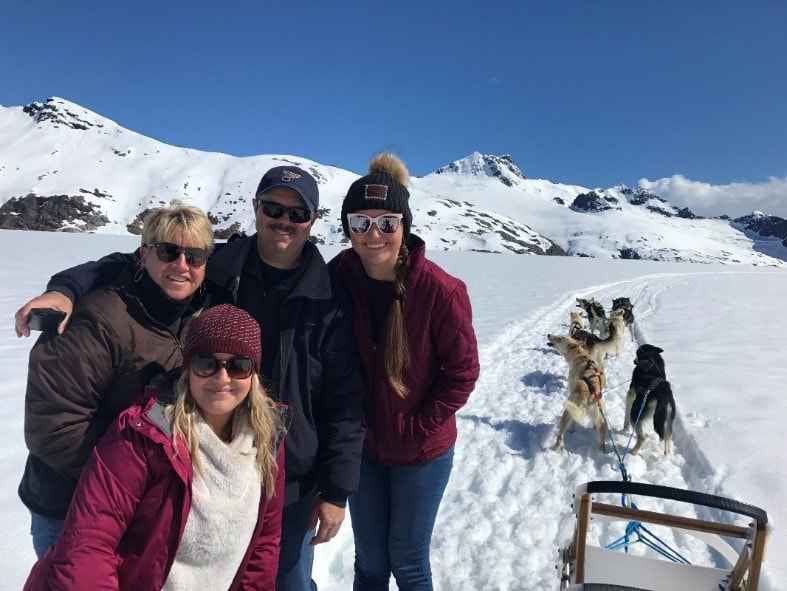 Family with Sled Dog