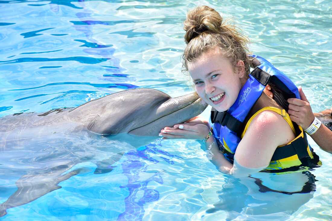 Mickey's granddaughter enjoying a Dolphin Encounter excursion while in Mexico