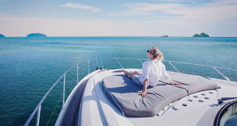Woman relaxing on private yacht deck