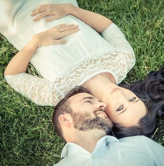 Couple posing in grass